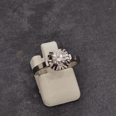 null RING in 18K gold (750 thousandths) and 900 mm platinum set with a brilliant...