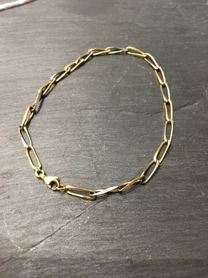 null BRACELET in alternating 18K (750 thousandths) yellow and white gold with an...