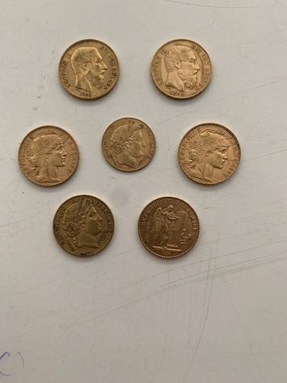 null Lot de pièces en or comprenant :

- 2 pièces de 20 F "au coq" 1906 et 1912.

-...