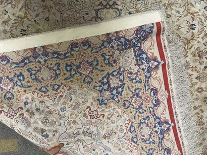 null Silk carpet with polychrome decoration on an off-white background of floral...