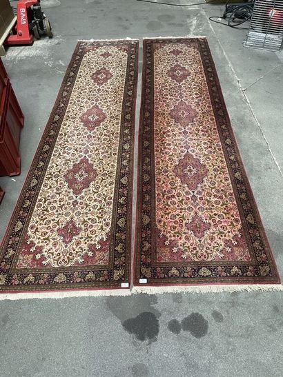 null Pair of silk hallway rugs with polychrome decoration of moving cartouches in...