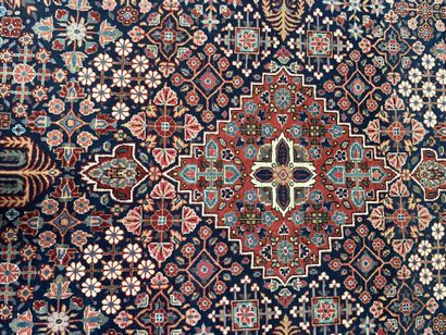 null Pair of woolen rugs with polychrome decoration of stylized floral motifs on...