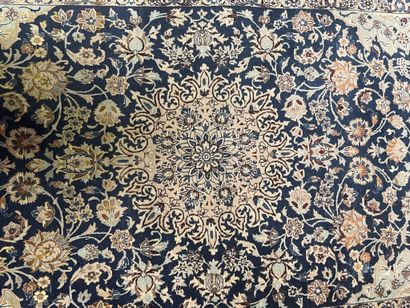 null Wool and silk carpet with polychrome decoration of a central rose in a frame...
