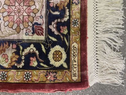 null Polychrome silk carpet decorated with floral motifs on a red background.

Bears...