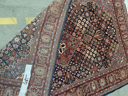 null Pair of woolen rugs with polychrome decoration of stylized floral motifs on...