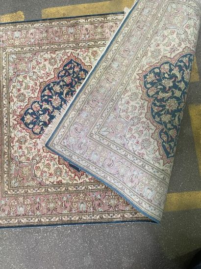 null Small silk carpet with polychrome floral decoration on a blue duck background....