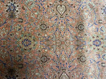 null Silk carpet with polychrome floral decoration on a red background.

Bears a...
