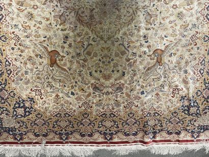 null Silk carpet with polychrome decoration on an off-white background of floral...