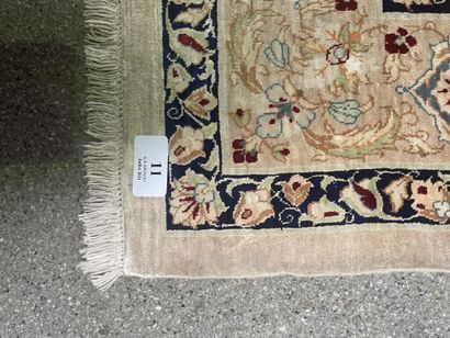 null Silk carpet with polychrome decoration of a central rose in a frame of stylized...