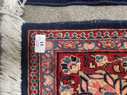 null Pair of woolen rugs with polychrome decoration of stylized floral motifs on...