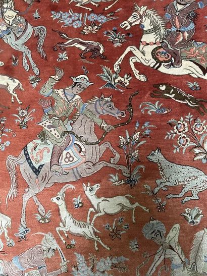 null Silk carpet with polychrome decoration of a hunting scene on a red background.

Bears...