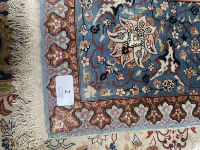 null Silk prayer rug with polychrome decoration of floral motifs and inscriptions....