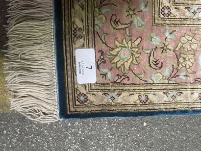 null Small silk carpet with polychrome floral decoration on a blue duck background....