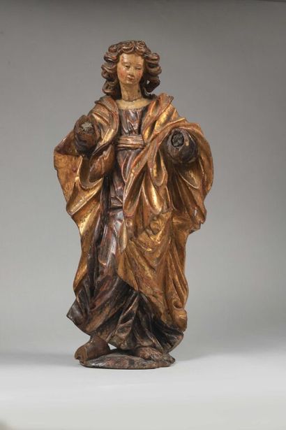  Saint Jean en bois sculpté, polychromé et doré, dos ébauché. Debout, il est vêtu...