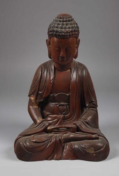 null VIETNAM.

Bouddha en bois laqué brun rouge et partiellement doré représenté...
