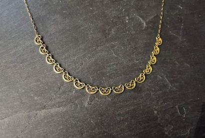 null COLLIER en or jaune 750 mm à maille bâtonnets ornée de quinze motifs tête de...