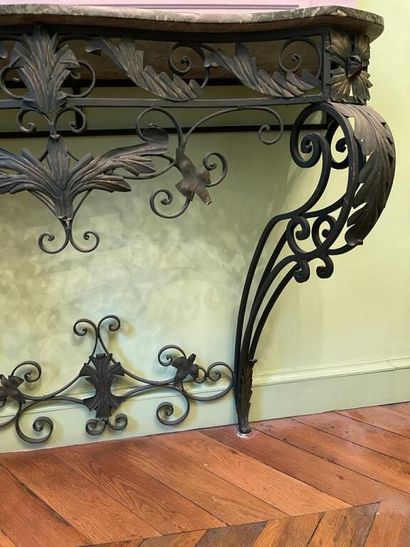 null Console in wrought iron relacquered green resting on two cambered feet decorated...