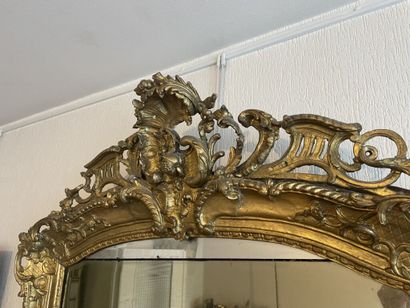 null Mirror with pediment out of carved and gilded wood of rectangular form with...