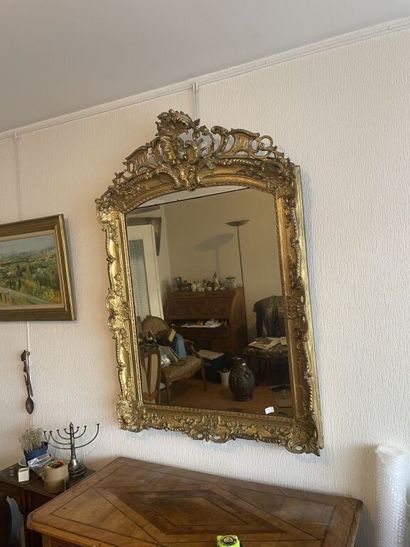 null Mirror with pediment out of carved and gilded wood of rectangular form with...