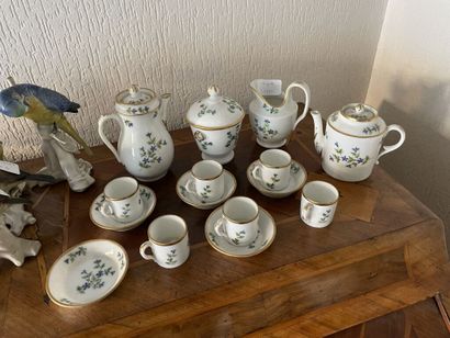  Porcelain dinette service including 6 cups, 5 saucers, two pourers, a milk jug and...