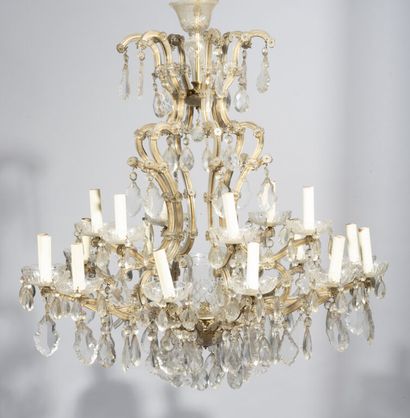 null Chandelier with eighteen arms of light, the arms in gilded metal covered with...