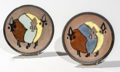 null ANONYMOUS MODERN WORK.

Pair of circular plates in polychrome enamelled ceramic...