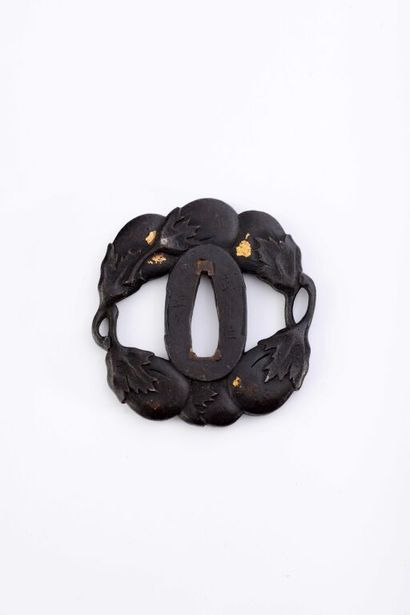 null JAPAN.

Openwork iron tsuba in positive, engraved and chiseled in relief of...