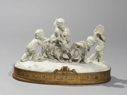  Group in cookie of porcelain representing putti accompanied by a goat, the frame...