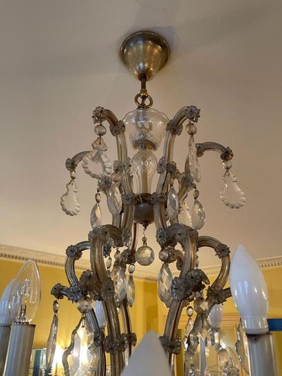  Chandelier with eighteen arms of light, the arms in gilded metal covered with grooved...