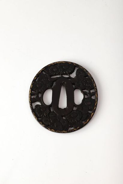 JAPAN.

Oval iron tsuba, engraved and chiseled...