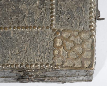  Rectangular chest with curved lid, sheathed in studded leather. The ornaments in...