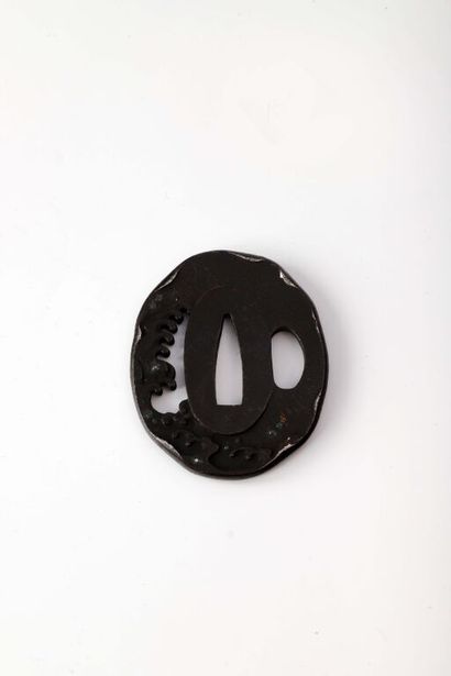 null JAPAN.

Black patina iron oval tsuba with engraved, chiseled, openwork and inlaid...