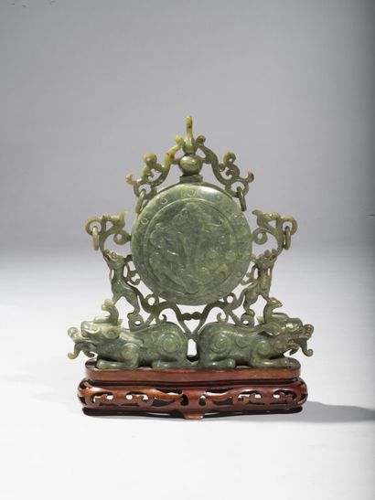 CHINA.

Group in carved green stone representing...