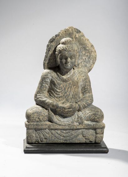 null Greco-Buddhist art of GANDHARA.

Statue of haloed Buddha in grey schist, represented...
