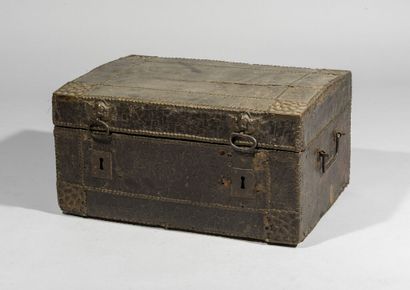 null Rectangular chest with curved lid, sheathed in studded leather. The ornaments...
