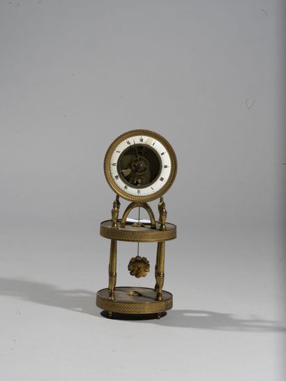  Small skeleton clock in varnished brass, resting on a portico in the shape of tempietto....