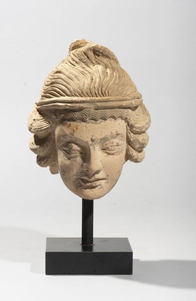 In the style of GANDHARA.

Head in stucco...