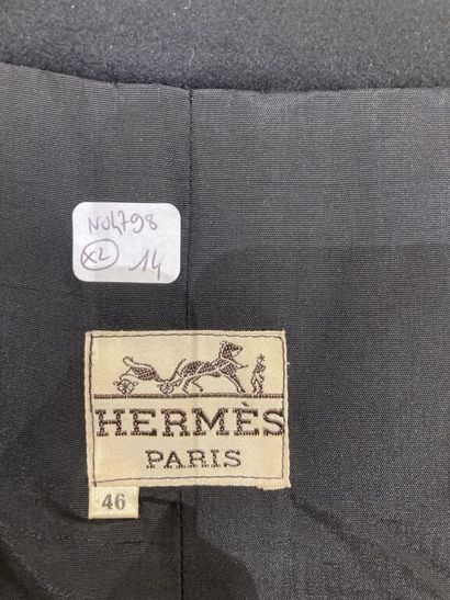  HERMES Paris 
Set of two long wrap skirts: 
- The first flared in black wool sheet,...