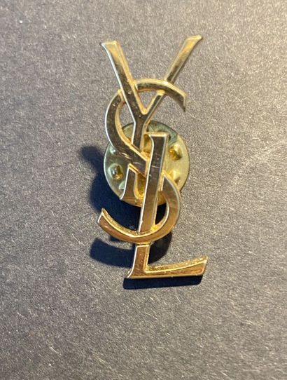 YVES SAINT LAURENT

Pin in gilded metal representing...