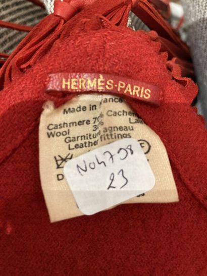  HERMES Paris 
Triangular shawl in red Hermes wool and cashmere blend embellished...