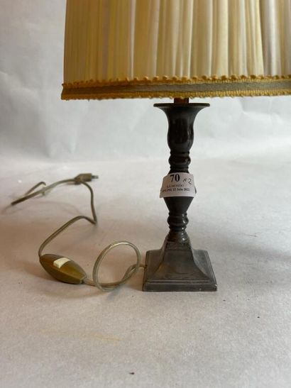 null Pewter candlestick mounted in lamp.

We joined a brass lamp.