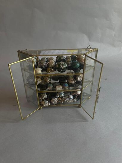 Small gilded brass and glass display case...