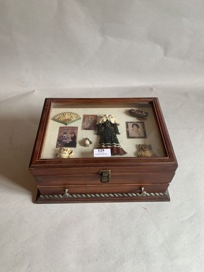 null Wooden sewing box opening by the top and a drawer at the bottom, the lid decorated...