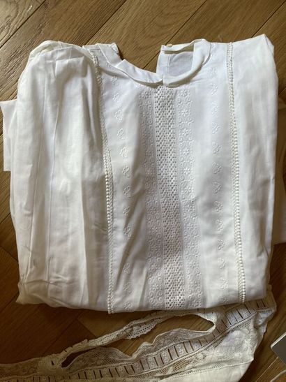 null Lot of adult clothing in white cotton embroidered with three breeches pierced...