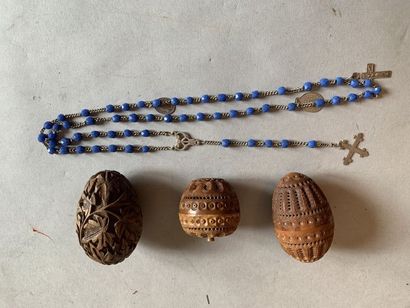 null Two eggs in carved corozo (one containing a rosary) and a wooden egg carved...