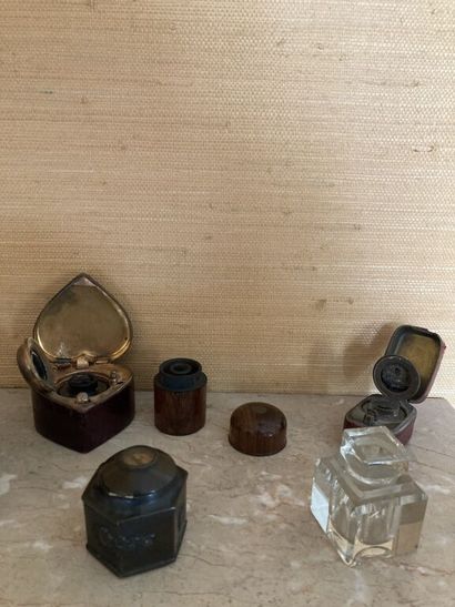 null A lot of seven inkwells, one in glass of square section with decoration of garland...
