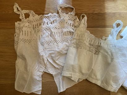 null Lot of adult clothing in white cotton embroidered with three breeches pierced...