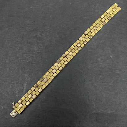 null MAUBOUSSIN - Georges LENFANT. About 1970. 

BRACELET in yellow gold 750 mm composed...