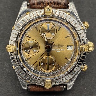 null BREITLING. 

750 mm gold and steel CHRONOGRAPH-BRACELET, champagne dial with...