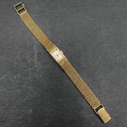 null EVIANA. 

Lady's wristwatch in yellow gold 750 mm, rectangular dial, flat mesh...